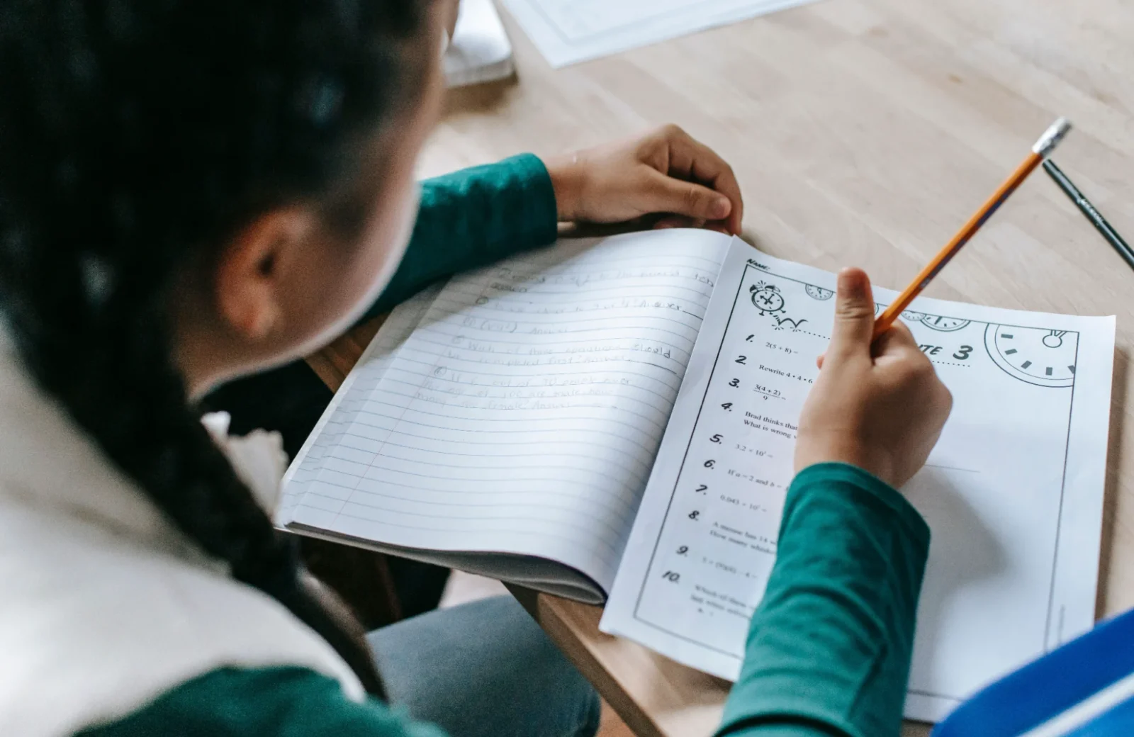 Child completing a learning worksheet