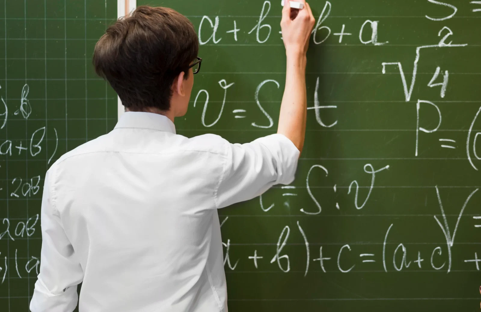 Learner working at a blackboard