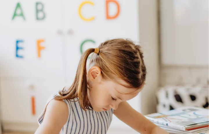 Young child drawing in an early learning environment